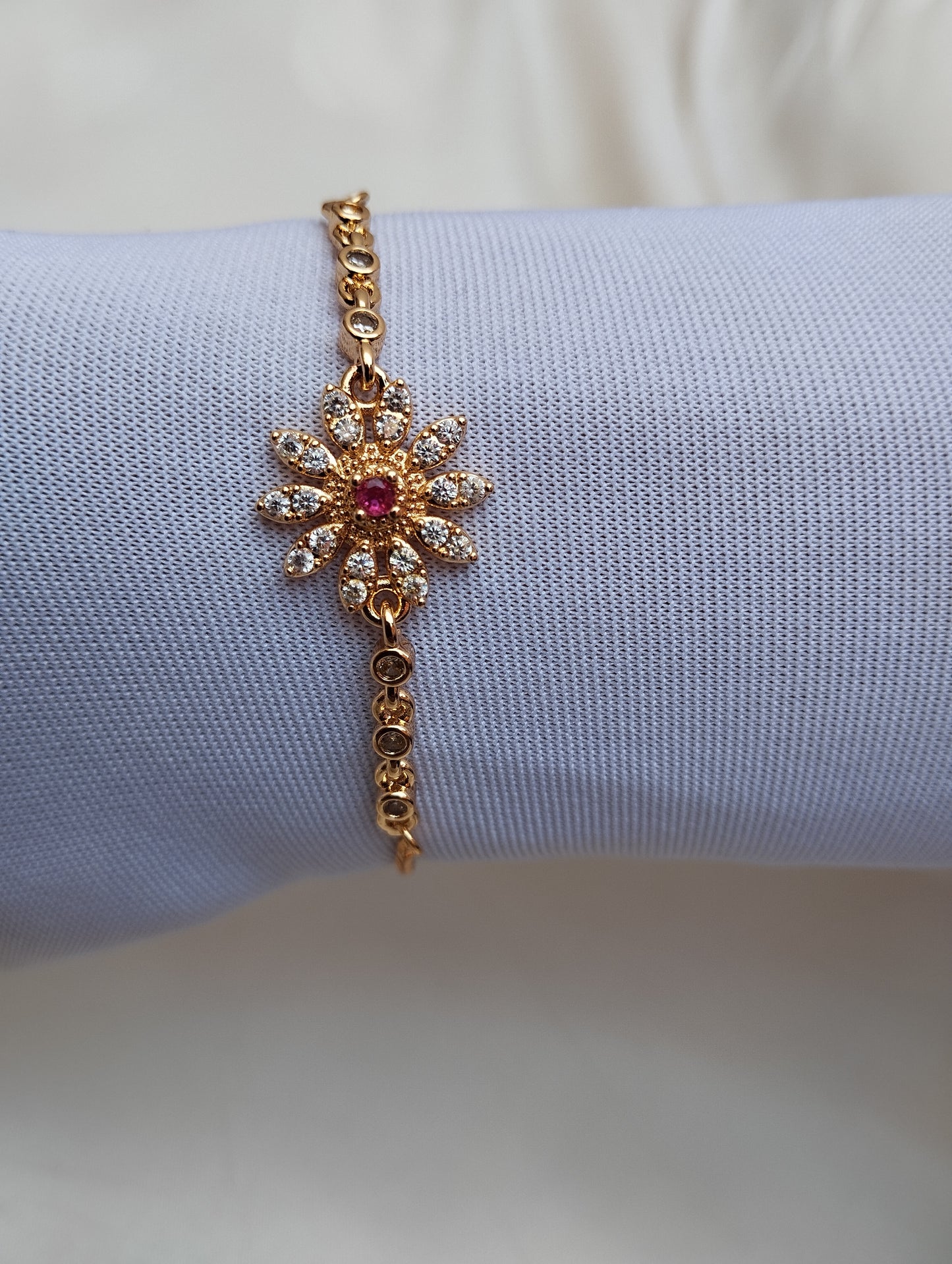 Golden Daisy Bracelet with Pink Stone Center