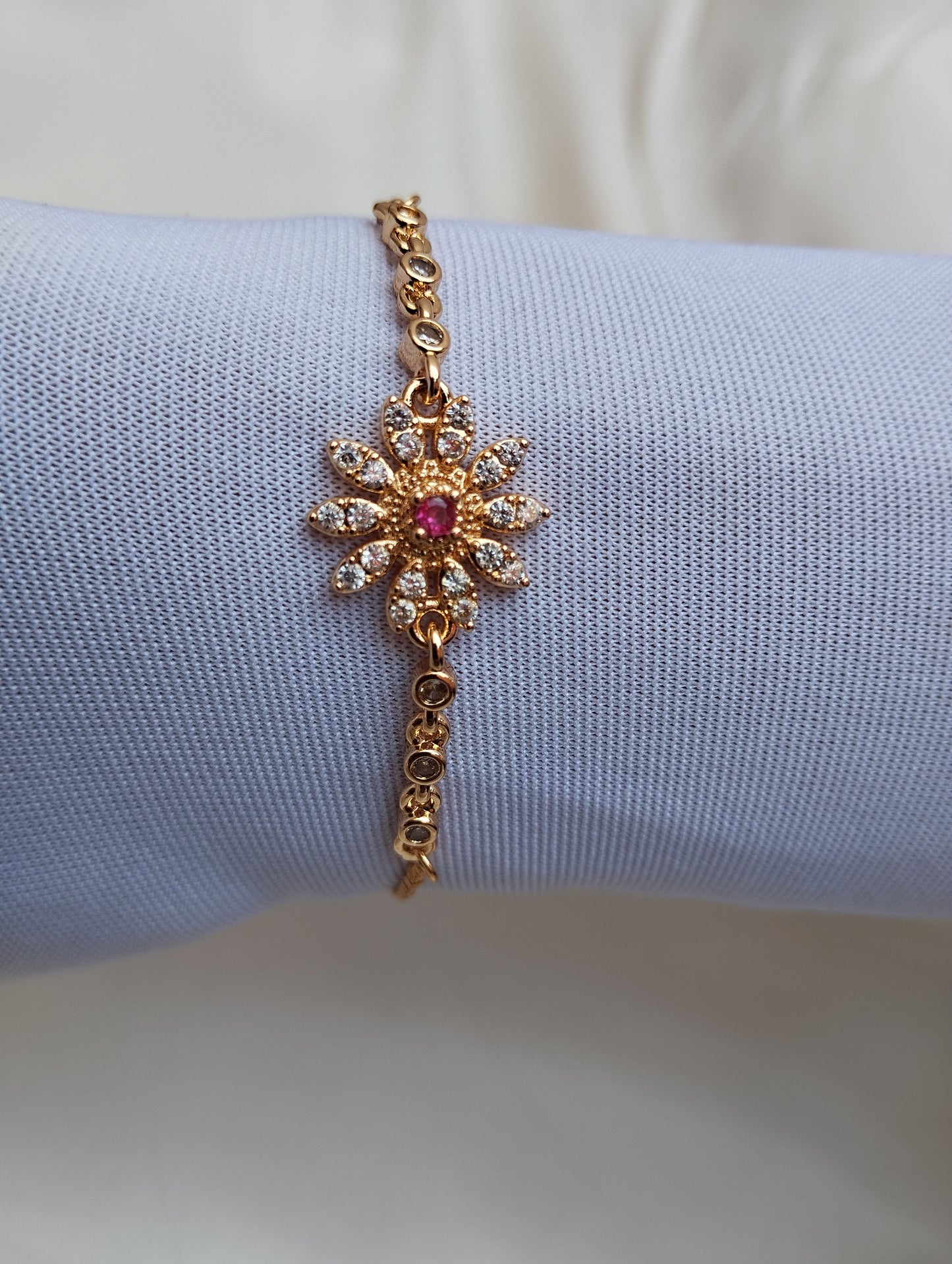 Golden Daisy Bracelet with Pink Stone Center